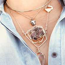 Load image into Gallery viewer, Abstract Initial Pendant layered styling with other necklaces. Model in photo is wearing a 16" bead chain with the initial pendant.