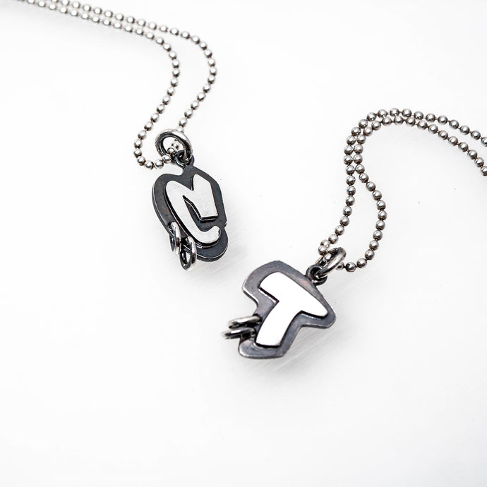Example of Abstract Inititial Tag Sterling Silver Pendants in letters C and T. By TIN HAUS® Jewelry.