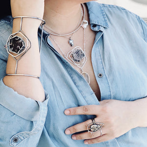 Mana Bracelet styling on model with the Fragmentation Necklace, Zoa Ring, Minimally Classic Choker, and a "T" Abstract Initial Pendant.